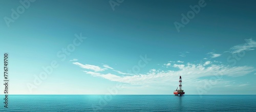 Drilling Rig Reaches for the Sky in Vast Landscape of Blue