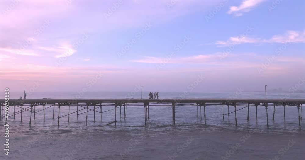 Aerial view of beauty sunset over the sea and dock with artisanal fishermen. Puerto Eten, Peru. Aerial view of beauty sunset over the sea and dock with artisanal fishermen. Puerto Eten, Peru.