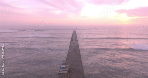 Puerto EtenAerial view of beauty sunset over the sea and dock with artisanal fishermen. Puerto Eten, Peru. 