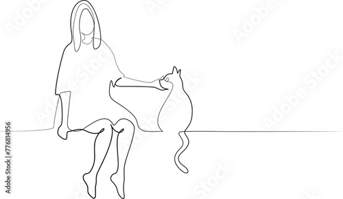 猫をなでる女性
