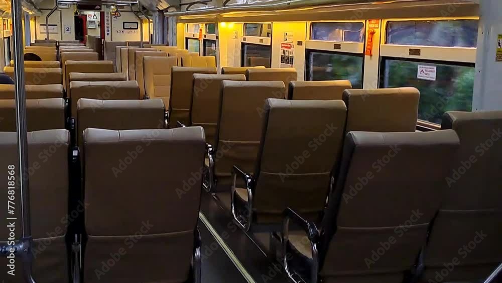 Public trains in Java, Indonesia are empty of passengers when it is almost dark. There were many empty seats on the intercity train and the carriages looked deserted Public trains in Java, Indonesia are empty of passengers when it is almost dark. There were many empty seats on the intercity train and the carriages looked deserted
