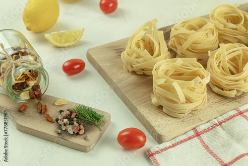 Dry pasta on a wooden surface. The process of making pasta