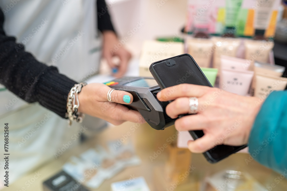 Customer Using Smartphone to Pay at a Retail Store