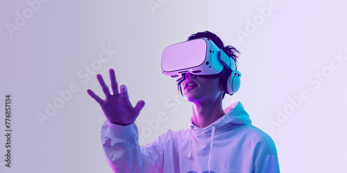 A teenager in vr glasses playing video games with virtual reality headset, trying to touch something with hand. Concept of digital metaverse and cyber world technology.