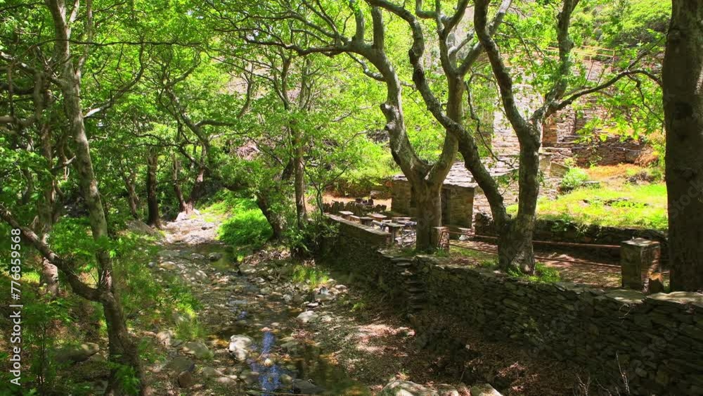 Old watermill building of Aris by river at coastal town of Karavostamo on Ikaria island, Greece at longevity blue zone Old watermill building of Aris by river at coastal town of Karavostamo on Ikaria island, Greece at longevity blue zone
