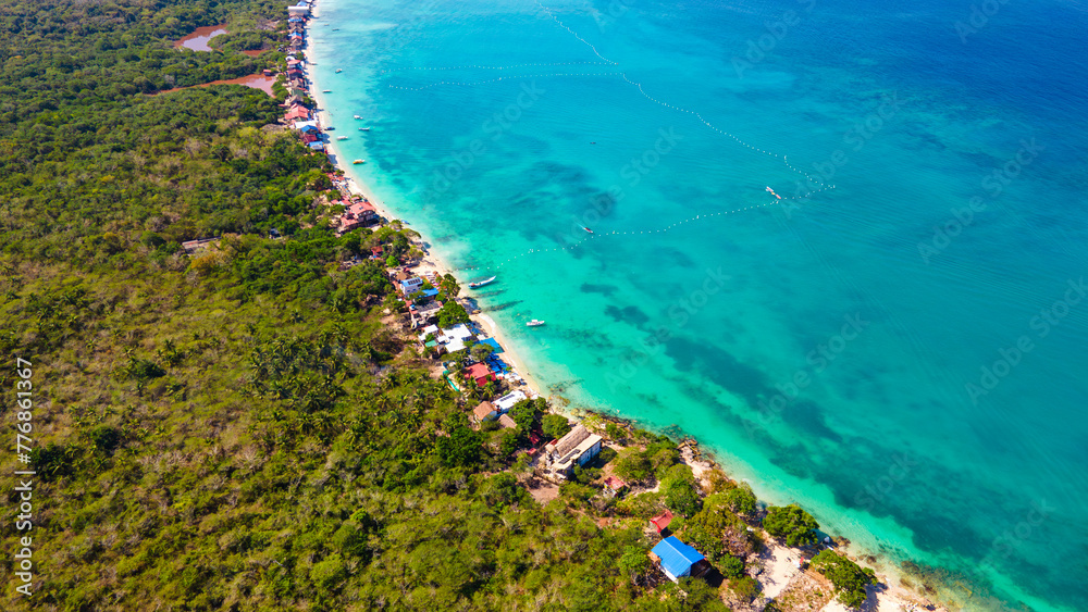 Aerial view of Baru, Cartagena showcasing the vibrant turquoise waters, lush greenery, and serene beaches
