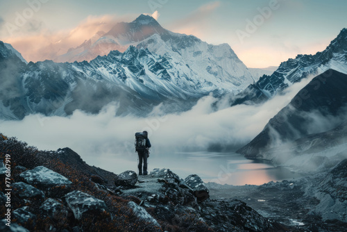 The picturesque evening view of Mount Everest from the Gokyo valley, with a traveler on the route to the Everest base camp photo