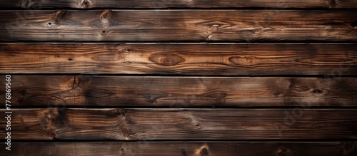 Wooden wall in focus with numerous planks creating a rustic and textured background