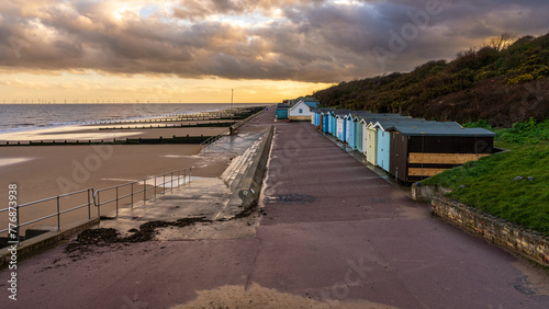 Beach huts on the North Sea coast at Frinton-on-Sea, Essex, England photo