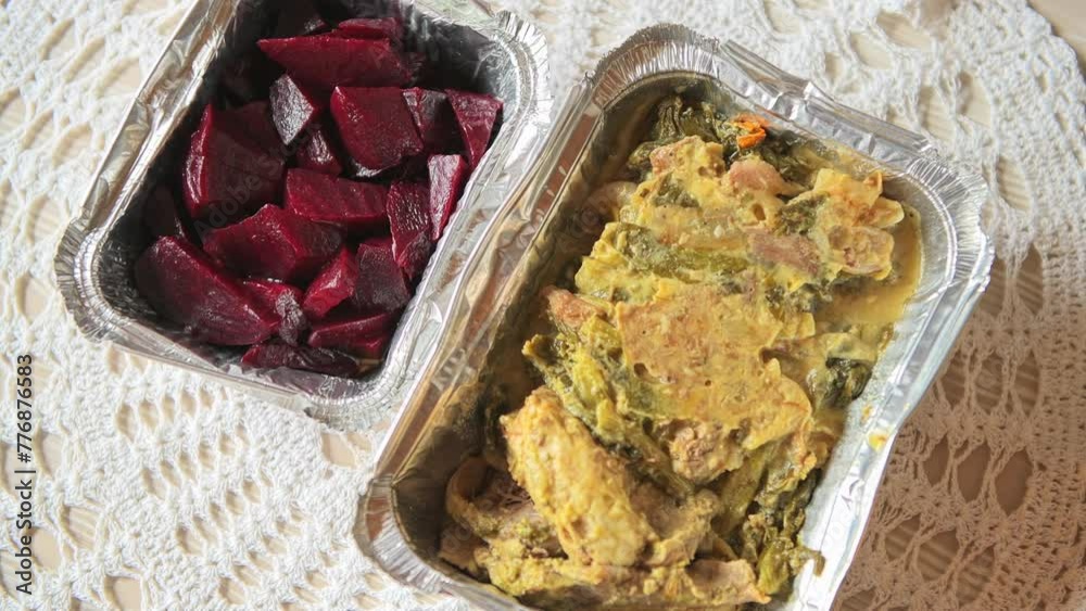 Red beet salad with olive oil and homemade goat kid meat soup with green kale cabbage vegetable potatoes in Karavostamo, Ikaria island Greece