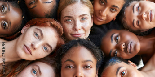 A group of women with different skin tones are standing close together