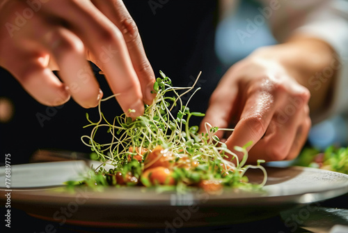 A chef's hands skillfully garnishing a gourmet dish with a handful of tender sprouts, adding texture and flavor to the presentation.