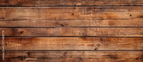Wooden wall featuring numerous wooden planks closely arranged in a rustic pattern