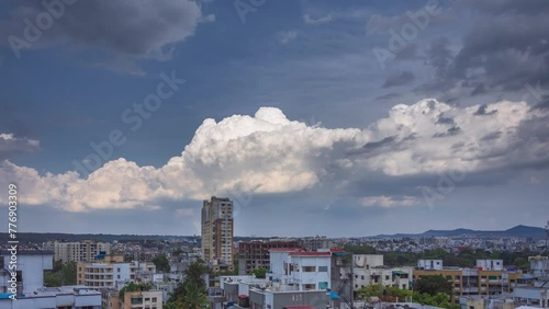 Timelapse of cotton candy clouds over a city with buildings in the foreground. Shot in 4K ultra HD 60fps for the smoothest and the clearest video experience.