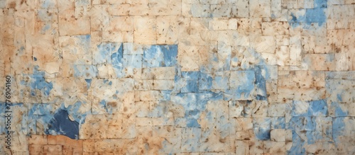 Close-up of a wall with deteriorating blue paint peeling off  revealing the aged surface underneath