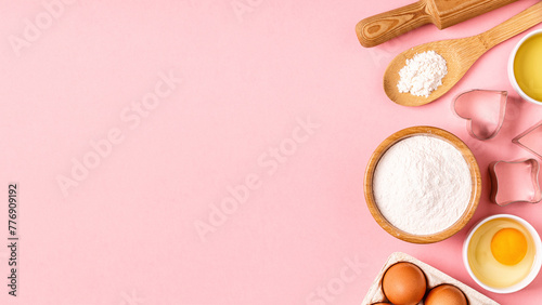 Ingredients and utensils for baking on a pastel background. photo