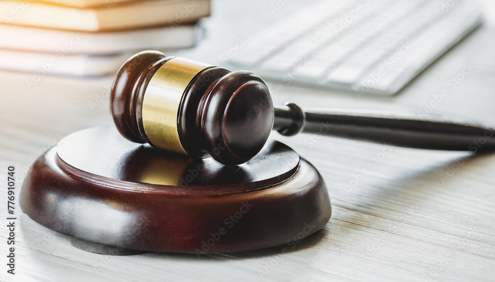 Obraz premium Brown wooden judge gavel on gray background