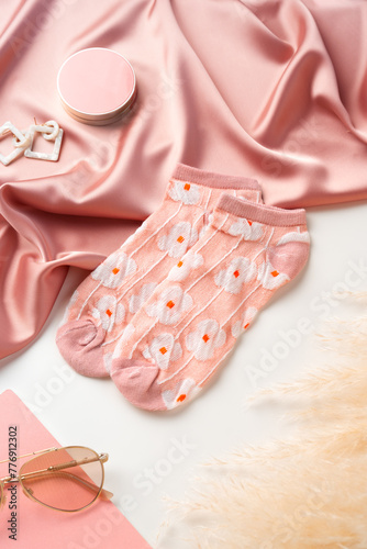 Pink socks with pattern on white background