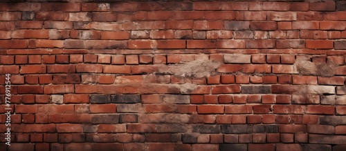 Brick wall made up of numerous red bricks, creating a solid and sturdy structure