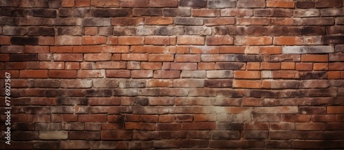 Old brick wall standing out against a dark and shadowy background, creating a striking and dramatic contrast