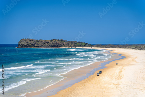 Scenic views looking towards Indian Head, with 4x4 vehicles driving on K'Gari, Fraser Island, Queensland, Australia.