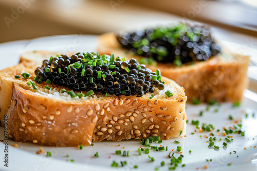 Black caviar toasts with chives