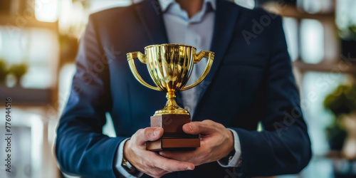 Achievement unlocked: Businessman with golden trophy