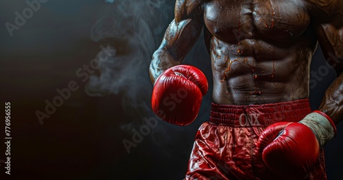 A Boxer's Pre-Competition Intensity, His Red Shorts and Glove a Vivid Beacon in the Dim Light © Gasspoll
