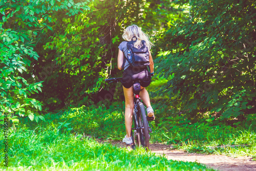 Cyclist ride on the bike path in the city Park 