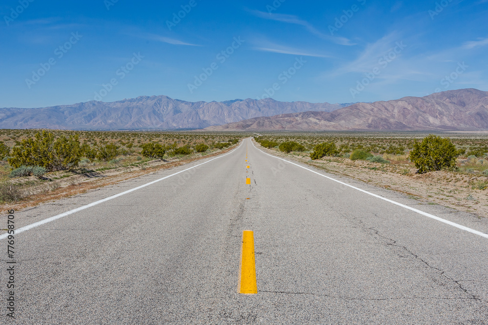 Empty highway in sunny weather. Location Anzo-Borrego Desert State Park, California Empty highway in sunny weather. Location Anzo-Borrego Desert State Park, California