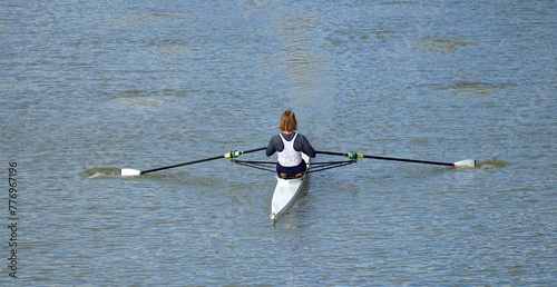 Female Sculler on the river Ouse at Bedford.