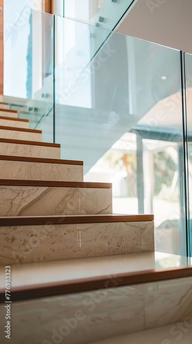   A modern staircase with sleek glass railings  reflecting the surrounding architecture.