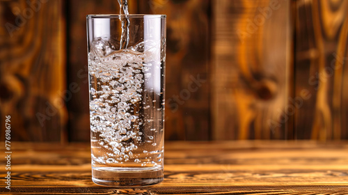A pristine glass brims with clear water, promising refreshment and hydration.