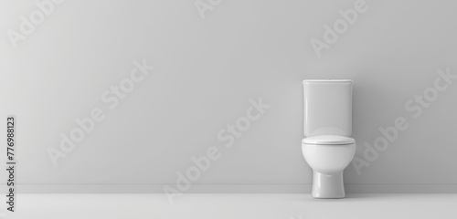 White modern toilet in a gray minimalist bathroom with shadows.