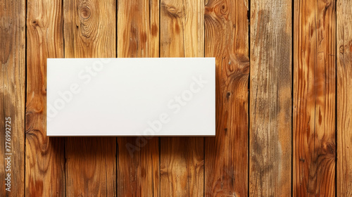 Horizontal rectangular blank white paper board, card on wooden plank background. Mock up for advertising photo