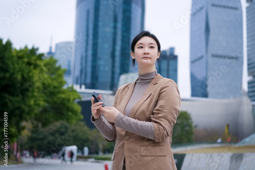 Confident Professional Using Smartphone in the City