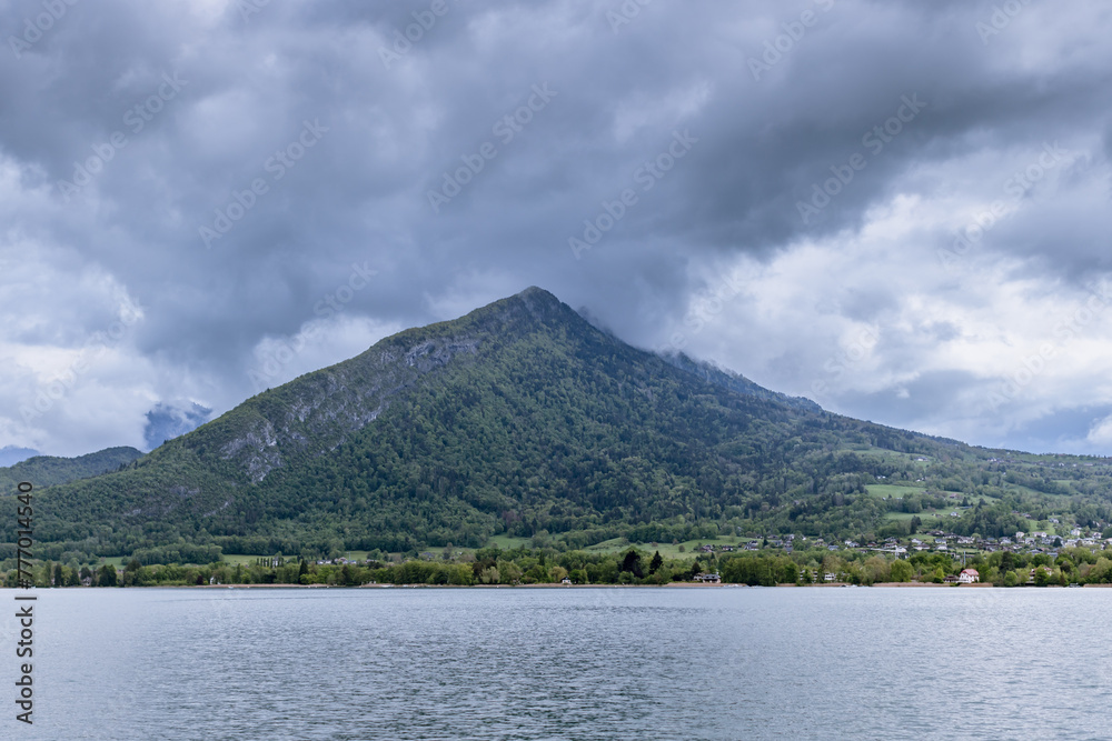 Scenic Lake Annecy beautiful mountains and coast - (French: Lac d'Annecy)