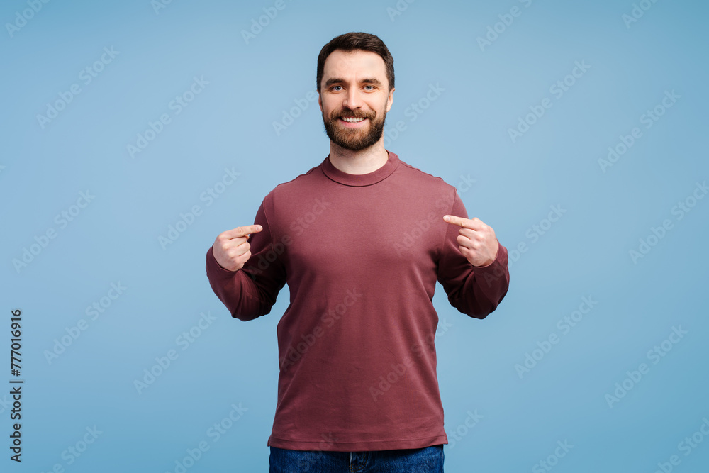 Smiling handsome bearded man, modern hipster wearing blank shirt pointing himself Smiling handsome bearded man, modern hipster wearing blank shirt pointing himself