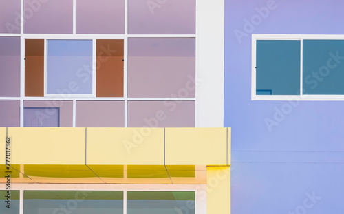 Geometric pattern background of glass window wall decoration with yellow roof awning tile of modern building