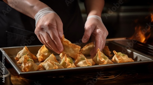 A chefs hands roll and fry samosas in a closeup shot