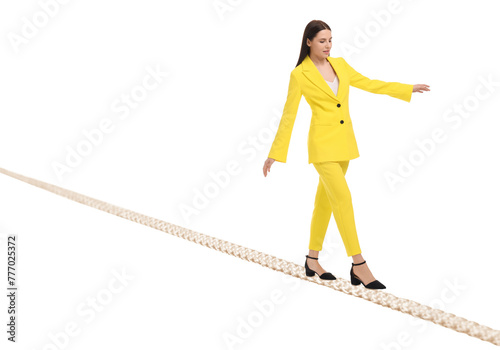 Businesswoman walking rope against white background. Risk or balance concept photo