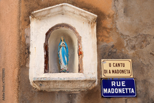 In Bonifacio, in Corsica (nicknamed the Island of Beauty) we find Madonetta street (U cantu di a Madonetta) or street of little Madonna, because of the statuette located at the corner of a house