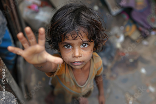 Beggar homeless child begging on the street photo