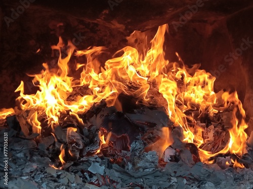 Burning firepaper and coals of a fire. Background for grilled food with fire.