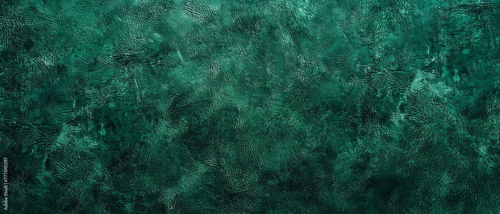 Soft focus image of green velvet fabric, highlighting the unique texture and luxurious feel of the material. Velvety alcantara texture