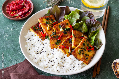 Fried tofu with rice and salad. Vegetarian food. Healthy eating. Diet.