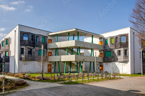 Berlin, Germany, March 7, 2024: modern housing blocks with white plastered facades connected by a sculptural staircase in Adlershof neighbourhood