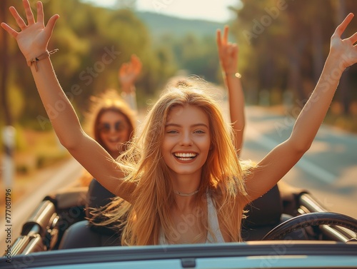 Summer Vacation and Car Trip Concept, young happy people enjoying a road trip and raising their hands up