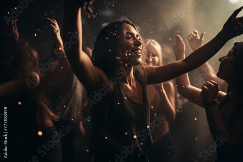 a beatiful woman with a joyfull smile is dancing in the middle of a pulsating crowd on the dancefloor photo