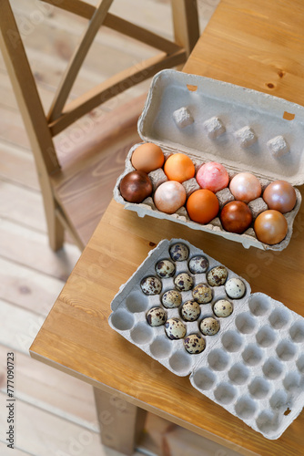 Easter chicken eggs and quail eggs in an egg box lie on the edge of the table. close-up, preparation for Easter, Easter morning, rustic, farming, natural products, christianity, ostara © Маргарита Трушина
